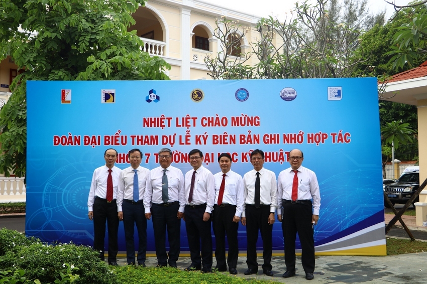 A group of men in uniform standing in front of a sign

Description automatically generated with medium confidence