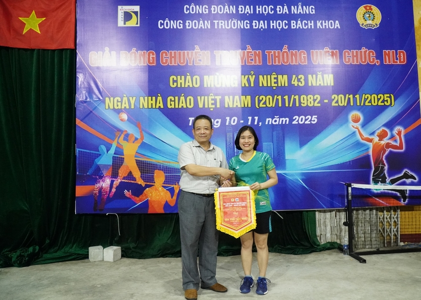 A person and person standing in front of a banner

AI-generated content may be incorrect.