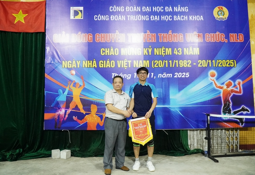 Two men standing in front of a banner

AI-generated content may be incorrect.