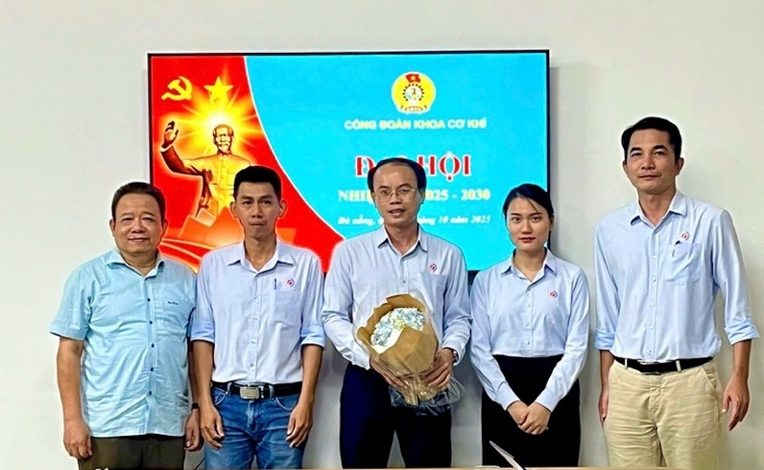 A group of people standing in front of a tableAI-generated content may be incorrect.