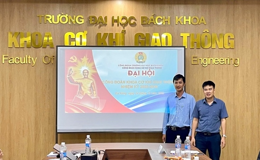 A group of men standing in front of a large table with a projector screenAI-generated content may be incorrect.