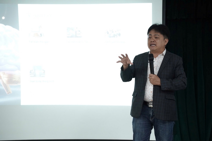 A person standing in front of a projection screen

AI-generated content may be incorrect.