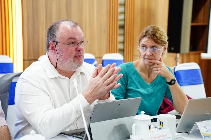 A person and person sitting at a table with a computer

AI-generated content may be incorrect.