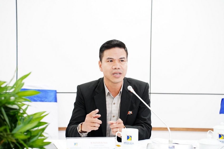 A person in a suit speaking into a microphone

AI-generated content may be incorrect.