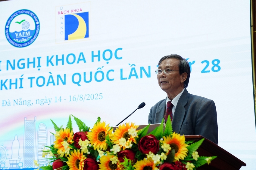 A person standing at a podium with flowers

AI-generated content may be incorrect.