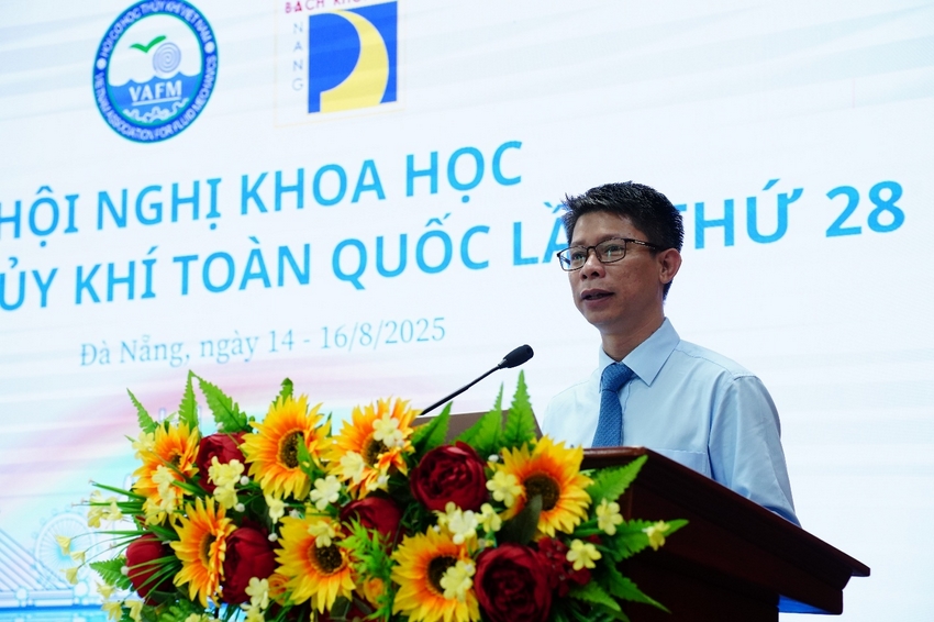 A person standing at a podium with flowers

AI-generated content may be incorrect.