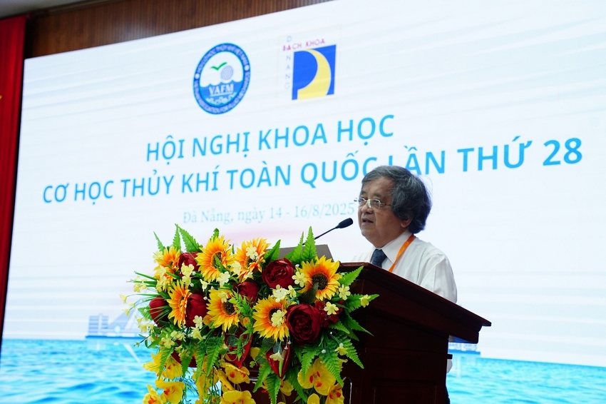 A person standing at a podium with a microphone

AI-generated content may be incorrect.