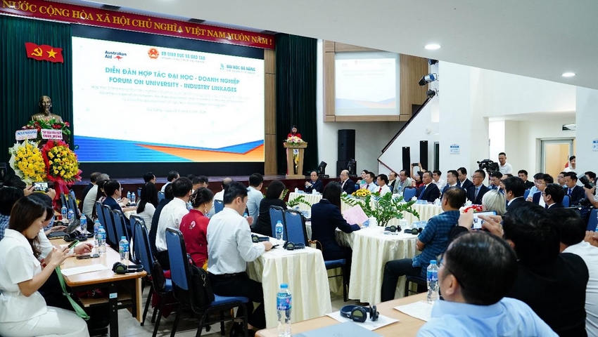 A group of people sitting at tables in front of a large screen

AI-generated content may be incorrect.