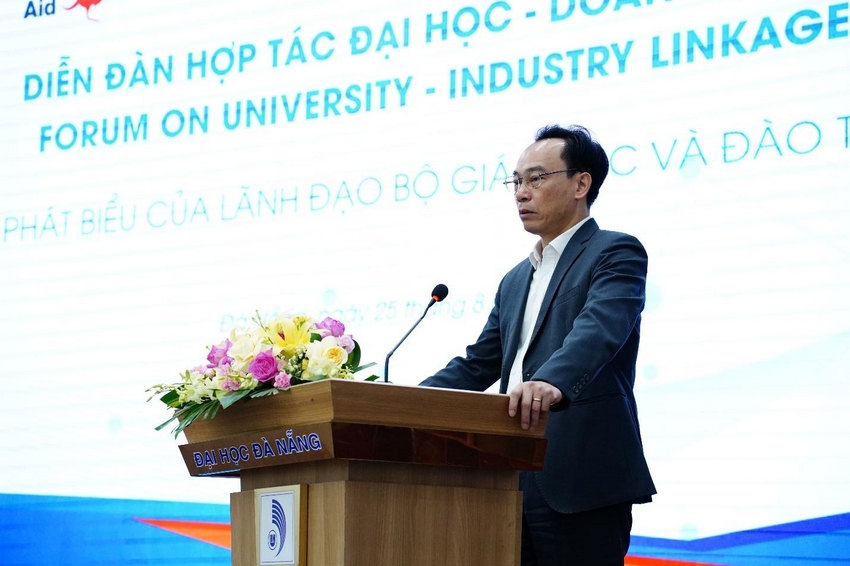 A person standing at a podium with flowers

AI-generated content may be incorrect.