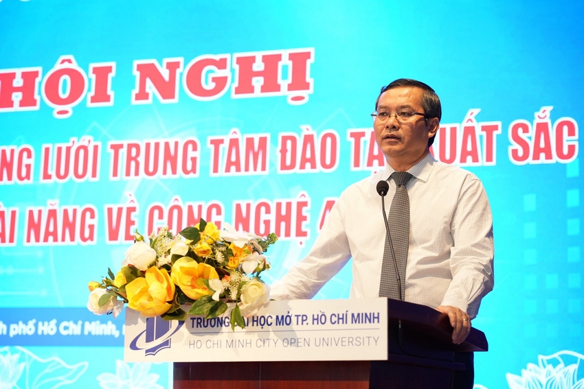 A person standing at a podium with flowers

AI-generated content may be incorrect.