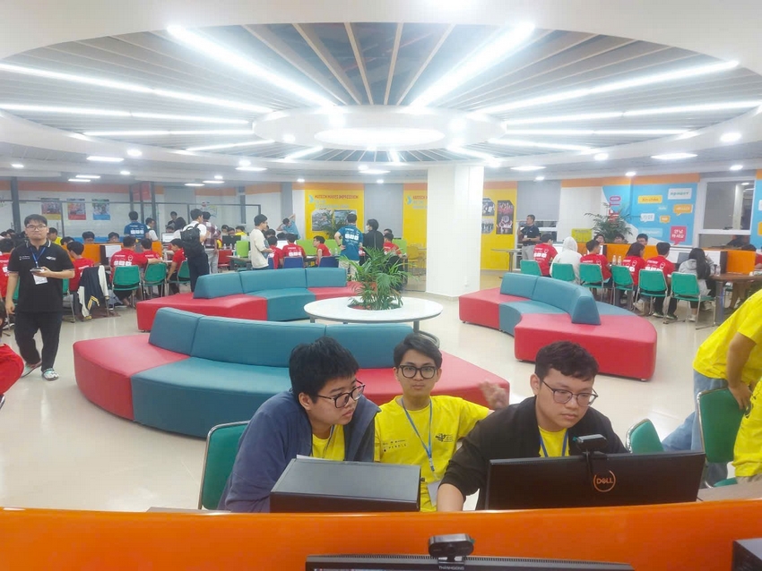 A group of people sitting at computers in a room with colorful seating

AI-generated content may be incorrect.