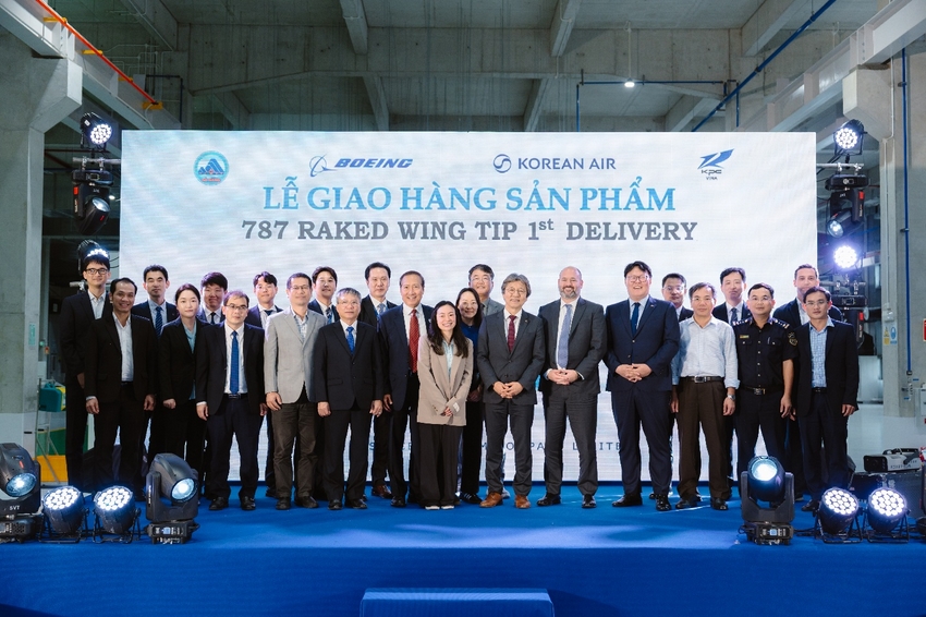 A group of people standing on a blue stage

AI-generated content may be incorrect.