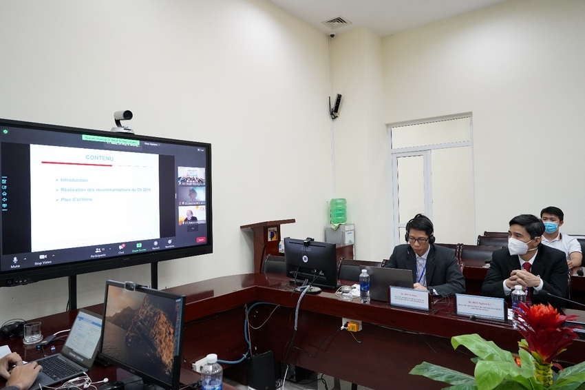 A group of people sitting at desks with computers

Description automatically generated with low confidence