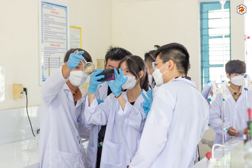A group of people wearing white lab coats and masks

Description automatically generated with low confidence