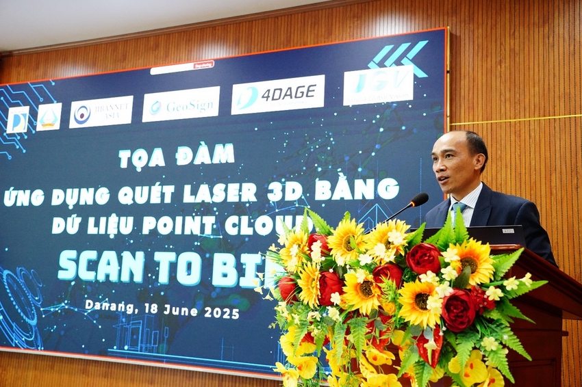 A person standing at a podium with a microphone and flowers

AI-generated content may be incorrect.