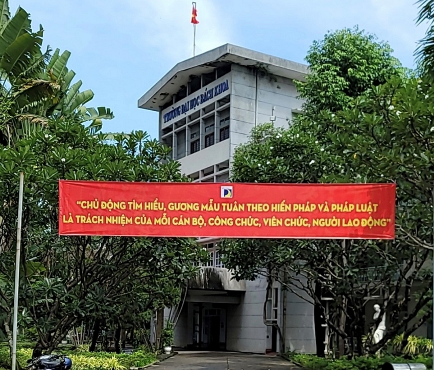 A building with a red banner

Description automatically generated