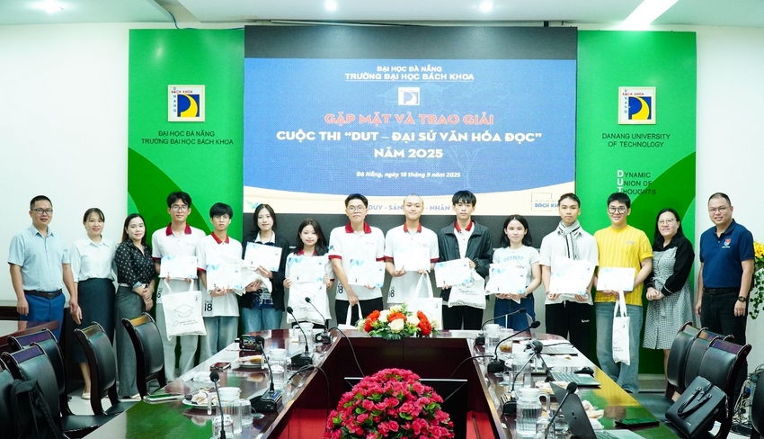 A group of people standing in front of a table

AI-generated content may be incorrect.