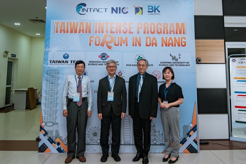 A group of people standing in front of a sign

AI-generated content may be incorrect.