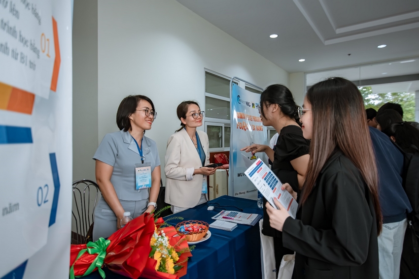 A group of women standing around a table

AI-generated content may be incorrect.